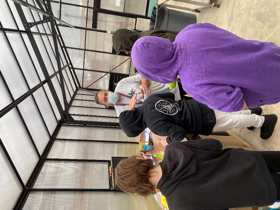 Kids learning in the greenhouse